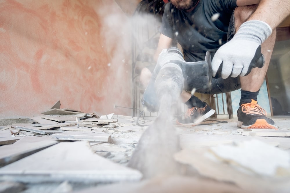 Ultra Fine Particles A person with a drill create ultra fine particle dust from a floor,