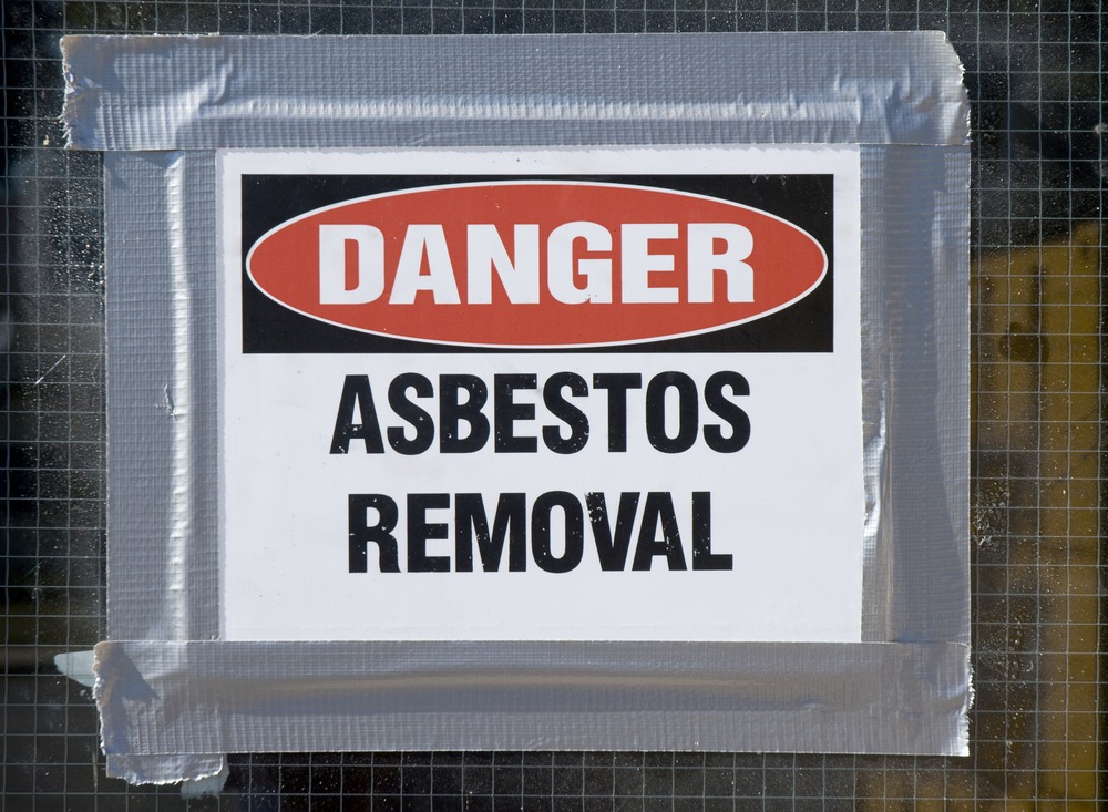 Danger,Asbestos,Removal,Sign,Posted,On,School,Window.